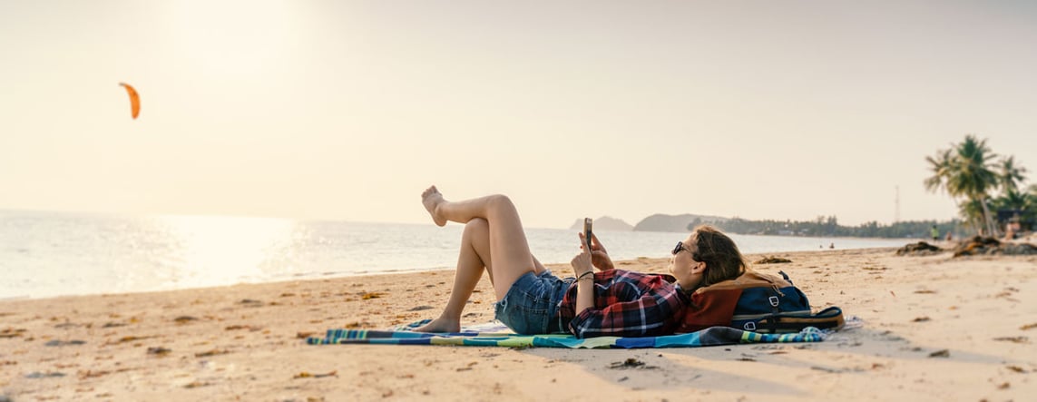 women-beach-phone